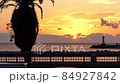 The dawn of Atami where a ship goes through the sea of palm trees and lighthouses 84927842