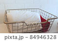 Woman folds towels. Principle of vertical storage.  84946328