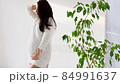beautiful pregnant woman at home in a white room waiting for a baby 84991637