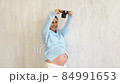 beautiful pregnant woman photographer with camera 84991653