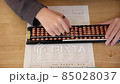 Girl in abacus calculation 85028037