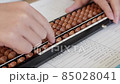 Hands during abacus calculation 85028041
