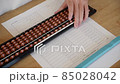 Hands during abacus calculation 85028042