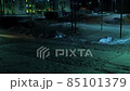 Time lapse of car traffic in early winter morning on poorly lit snowy street 85101379