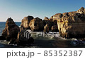 Cliffs in Portugal aerial view. Drone flight over Ponta Da Piedade at beautiful sunrise over the Atlantic ocean. Cliffs in Portugal aerial view. Drone flight over Ponta Da Piedade at beautiful sunrise over the Atlantic ocean. 85352387