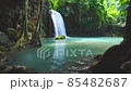 Waterfalls and fish swim in the emerald blue water in Erawan National Park. Erawan Waterfall is a beautiful natural rock waterfall in Kanchanaburi, Thailand.Onsen atmosphere. Fresh nature.4K 85482687