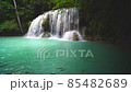 Waterfalls and fish swim in the emerald blue water in Erawan National Park. Erawan Waterfall is a beautiful natural rock waterfall in Kanchanaburi, Thailand.Onsen atmosphere. Fresh nature.4K 85482689