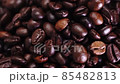 Dark Coffee beans,Coffee beans splashed from above,Coffee beans. Close up of seeds of coffee. Beautiful seeds of coffee. 85482813
