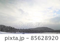 Flying over the timelapse clouds in winter, during snowfall, beautiful landscape 85628920