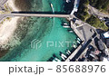 A ship entering a harbor in the clear sea 85688976