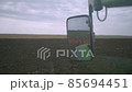 Harvesting in the field. Land cultivation with a tractor 85694451