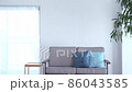 A woman decorating a flower in the living room 86043585