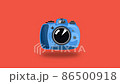 Blue beautiful cute camera makes a flash 86500918