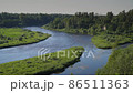 Russia. June 20, 2021. Picturesque view of the Msta river in sunny weather. Russia. June 20, 2021. Picturesque view of the Msta river in sunny weather. 86511363