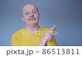 Senior man clapping and applauding with disbelief at his face. Studio shot 86513811