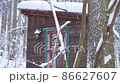 Snow scene mountain hut 86627607
