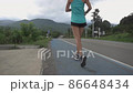 Runner asia Woman Running in the street road Outdoors. Sportswoman running  Morning Training at outskirts mountain and nature background. Healthy Lifestyle.slow motion shot. 86648434