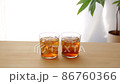 A glass of barley tea placed on a window table 86760366