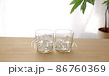A glass of ice placed on the table 86760369