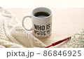 Image of hot coffee and knitting in a mug 86846925