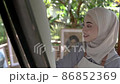 muslim asian female artist painting on canvas 86852369