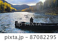 river autumn fisherman fishing from a boat fishing rod sunny 87082295