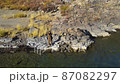 river autumn fisherman fishing at the edge of a cliff fishing rod from a copter 87082297