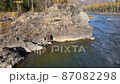 fisherman fishing at the edge of a cliff fishing rod 87082298