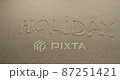 Panorama of the word HOLIDAY written on the beach sand. Beach holiday concept 87251421