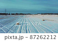 Aerial view of pile of haystacks in winter season. 87262212