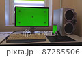 Green screen on computer and phone on desk zooming in, in slow motion 87285506