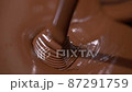 Close-up stirring chocolate, hot melted liquid chocolate. 87291759