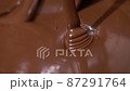 Close-up stirring chocolate, hot melted liquid chocolate. 87291764
