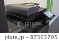Young man copies documents on a copying system in office 87363705
