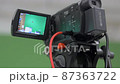 video technician plugs the HDMI cable into the camera 87363722