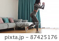 female butt workout squats at home. Fitness at home concept 87425176