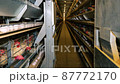 Large white chicken eggs are produced by laying hens sitting in huge cages under low light in a large poultry farm. 87772170