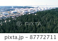 Huge oil storage tanks filled with gasoline in the middle of a pine forest on the coast of the North Sea. 87772711