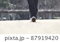Woman walking in the park 87919420