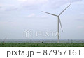The wind turbine in fields with clouds background. The wind turbine is a power generating station. Windmill on the field. Slow-motion 87957161