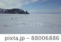 An expedition of atv riders travels along Lake Baikal. Shooting from a drone 88006886