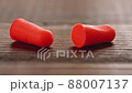 Two ear plugs expand size after pressure time lapse 88007137