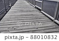 Walking on fishing pier with wooden boards and metal realign 88010832