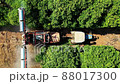 Overhead view of tractor sprays liquid fertilizers 88017300
