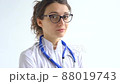 Female doctor is putting off protective blue gloves isolated on white background after some medical manipulations, vaccination. 88019743