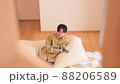 A man watching TV while relaxing at home Holiday 88206589