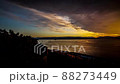 Fiery Weather Front Passes Down River At Sunset - Timelapse. 88273449