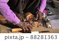 Close shot of making wooden idol by a wood artist at Bodhgaya in India. 88281363