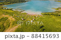 People taking sun baths at Lake Dontso in Leningrad region, Saint Petersburg Russia, aerial footage 88415693