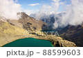 Flying into clouds above the Huaytapallana mountain range in Huancayo - Junin, Peru 88599603